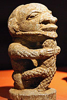 man with crocodile carving